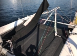 Genoa to port, gennaker starboard, both with their own zippered bag attached to the trampoline